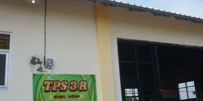 A building with a sign on the side Description automatically generated