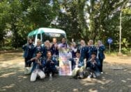 A group of people posing for a photo AI-generated content may be incorrect.