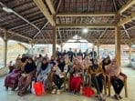 Mahasiswa KKN UNDIP Sosialisasi Kelola Kelembaban dengan Silica Gel dan Serap Air di Desa Blacanan A group of women sitting in chairs under a roof AI-generated content may be incorrect.