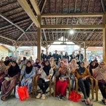 A group of women sitting in chairs under a roof AI-generated content may be incorrect.