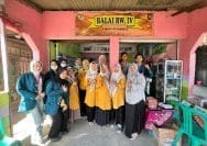 A group of women standing in front of a store Description automatically generated