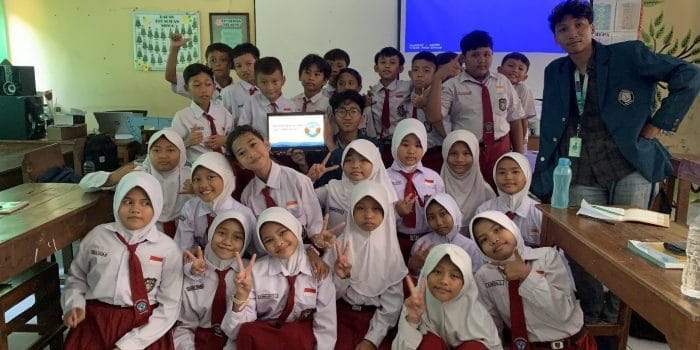 A group of children in uniform AI-generated content may be incorrect.