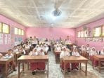 A group of people in a classroom AI-generated content may be incorrect.