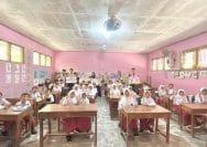 A group of people in a classroom AI-generated content may be incorrect.