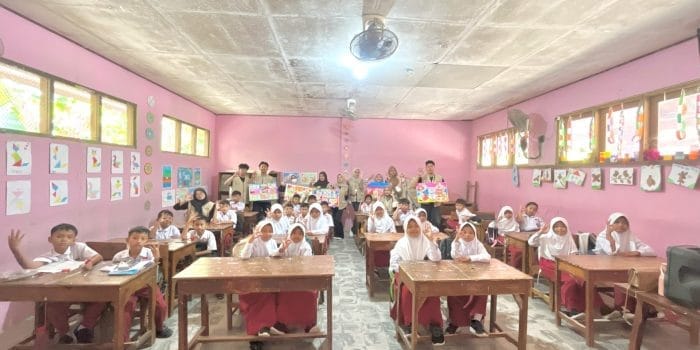 A group of people in a classroom AI-generated content may be incorrect.