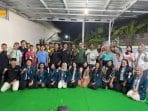 A group of people posing for a photo AI-generated content may be incorrect.