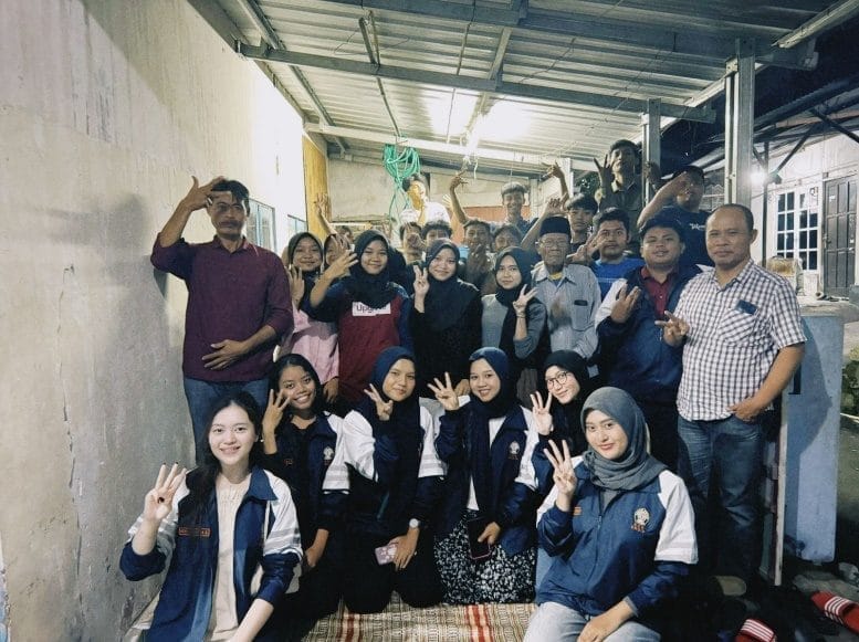 A group of people posing for a photoAI-generated content may be incorrect.