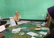 A group of people sitting around a table Description automatically generated