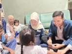 A group of people sitting on the floor AI-generated content may be incorrect.