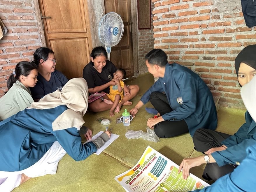A group of people sitting on the floor AI-generated content may be incorrect.