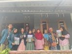 A group of people standing in front of a building AI-generated content may be incorrect.