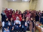 A group of women posing for a photo Description automatically generated
