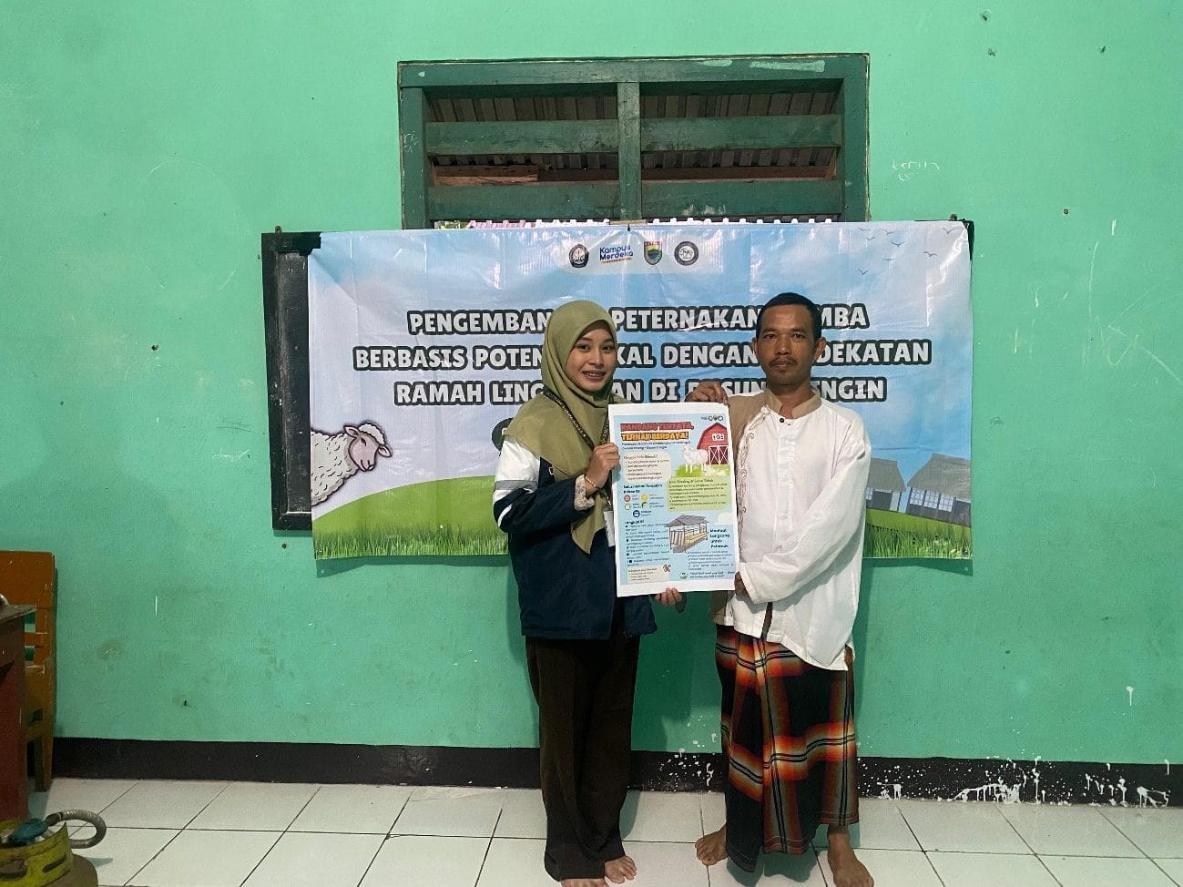 A person and person holding a poster Description automatically generated