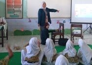 A person teaching a group of children AI-generated content may be incorrect.