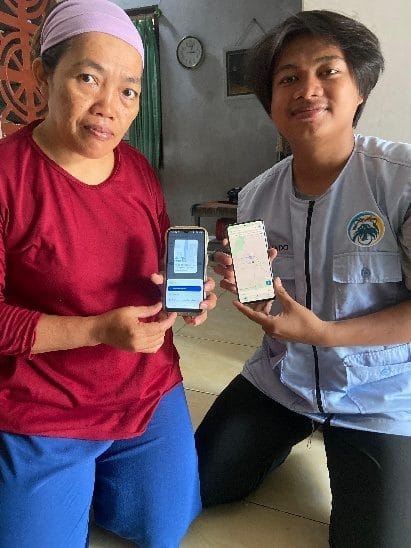 A couple of women holding cell phones AI-generated content may be incorrect.