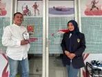 A person and person standing in front of a store AI-generated content may be incorrect.