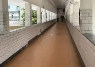 A long hallway with white brick walls AI-generated content may be incorrect.